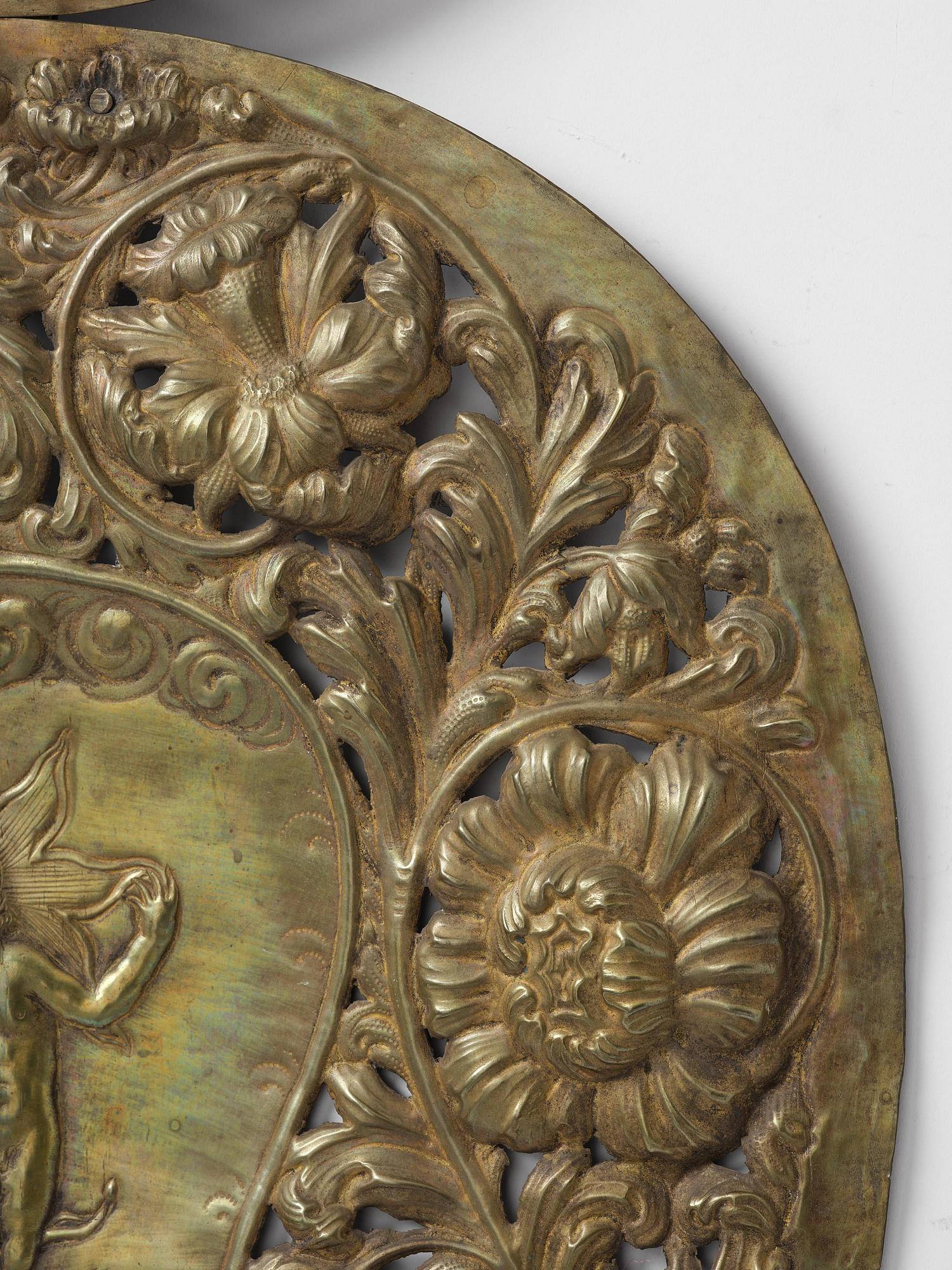 A set of four Swedish Baroque repoussé silvered brass reflector one-branch reflector plates, ca 1690-1700.