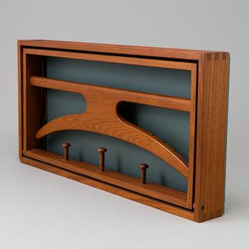 A clothes hanger by Adam Hoff & Poul Östergaard, Virum Möbelsnickeri, Denmark, mid 20th century.