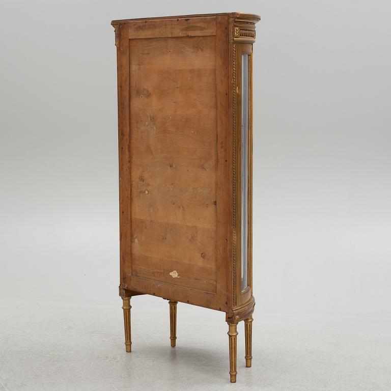 A Louis XVI-style display cabinet, circa 1900.