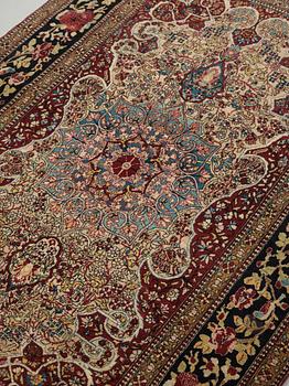 A RUG. An antique Esfahan. 212 x 141 cm.