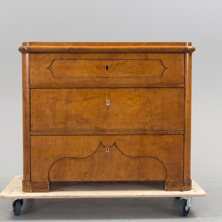 A late empire chest of drawers, mid 19th century.