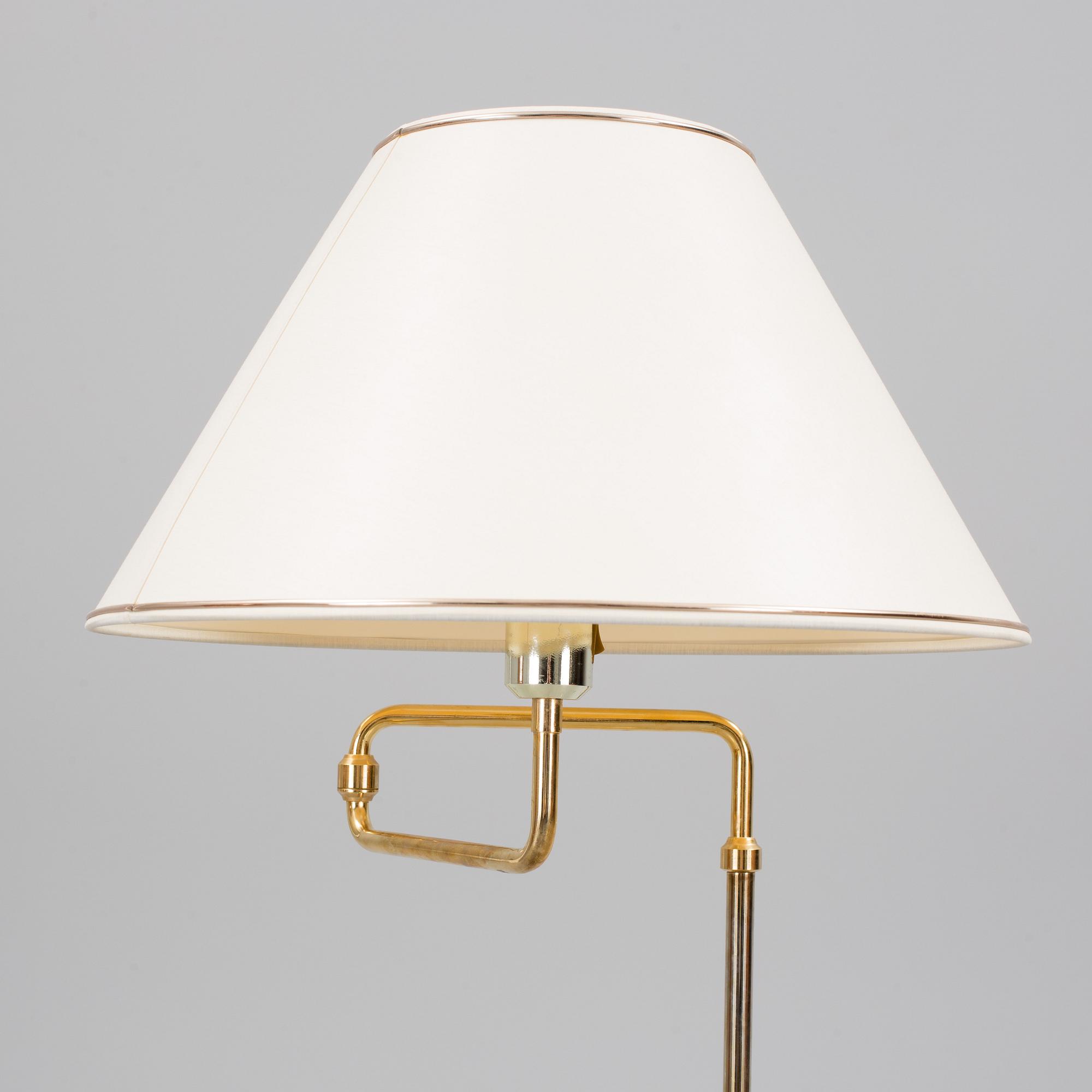 A second half of the 20th century brass wall light and a table light.
