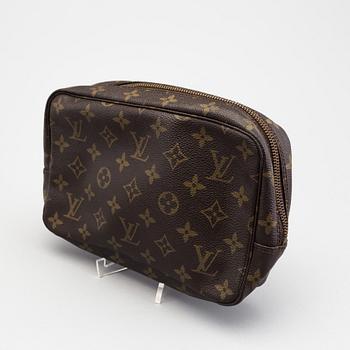 A Louis Vuitton toiletry bag.