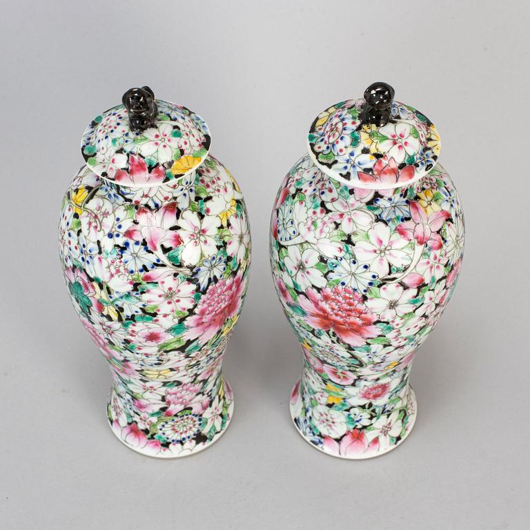A pair of Chinese 'Mille fleur' porcelain vases with covers, 20th century.