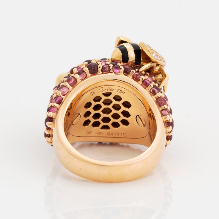 A Cartier bee ring in 18K gold and enamel set with round brilliant-cut diamonds, sapphires and emeralds.