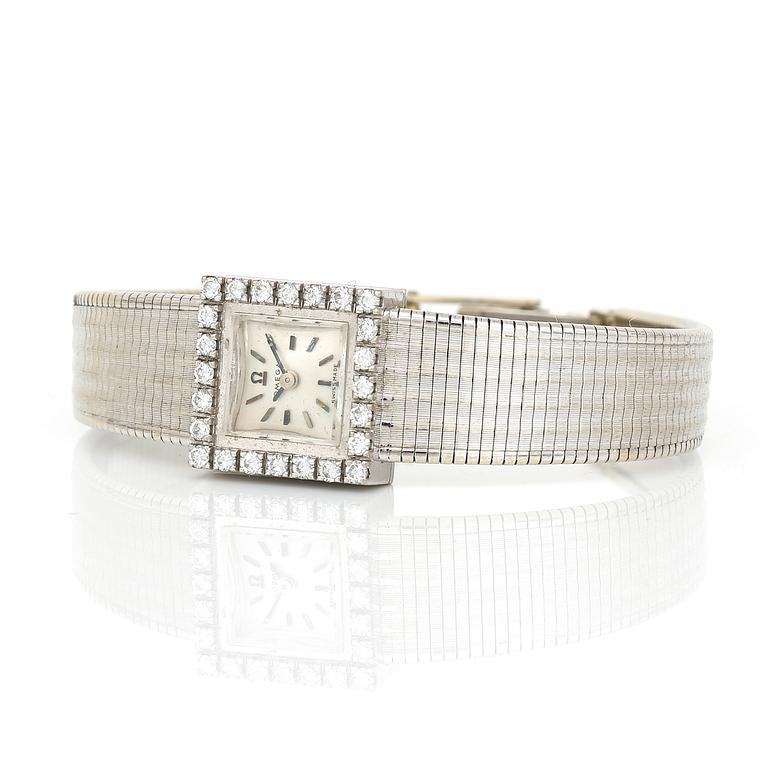 ARMBANDSUR, dam, 18K vitguld med briljantslipade diamanter, tot ca 0,72 ct, Omega. Total vikt ca 41 g.