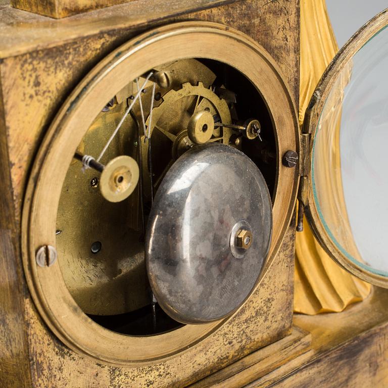 A French Empire early 19th century gilt bronze mantel clock.