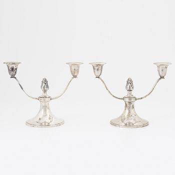 A pair of silver candelabras, Swedish import mark.