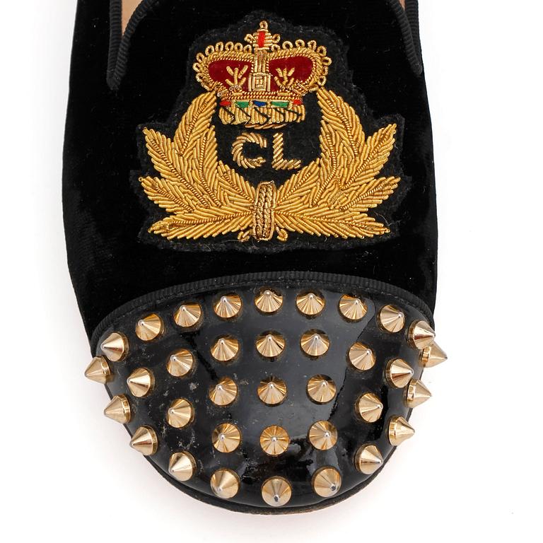 CHRISTIAN LOUBOUTIN, a pair of black velvet loafers with golden spikes, "Intern". Size 36,5.