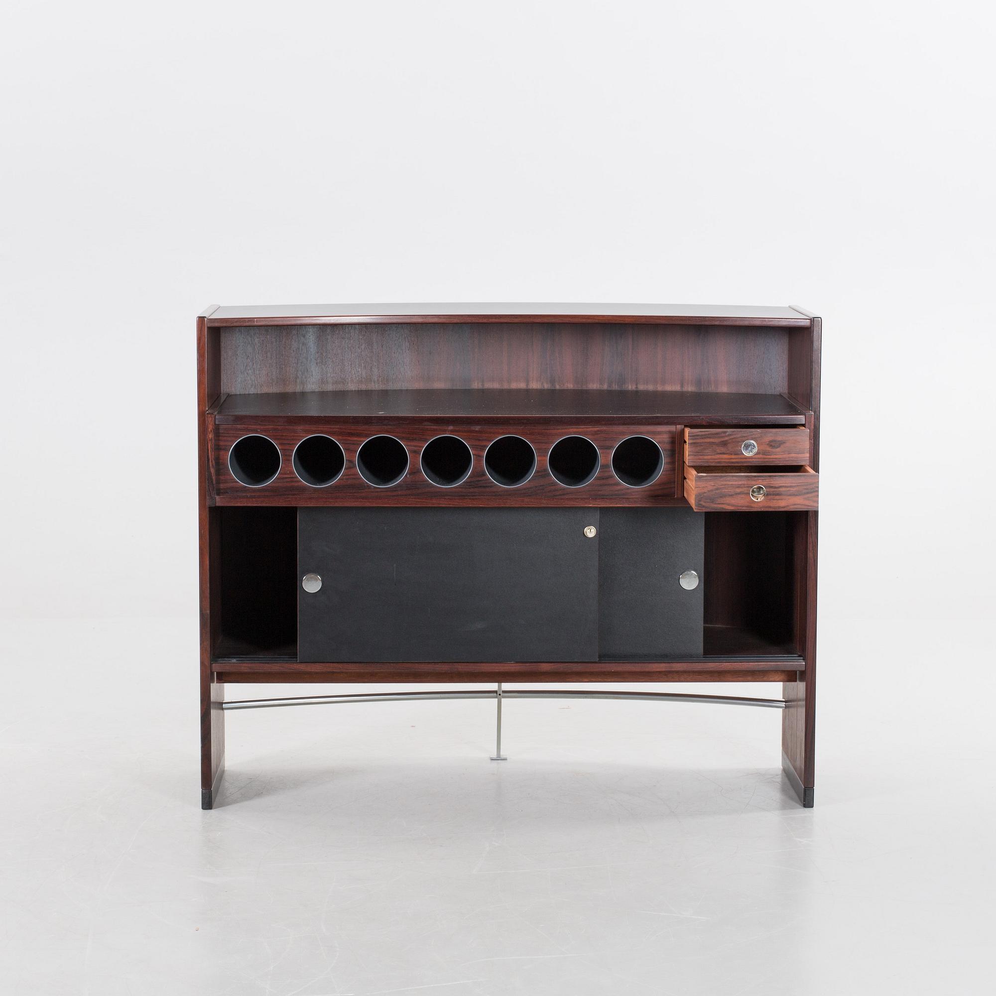 A danish 1960's Smith & Dyrlund bar with three barstools.