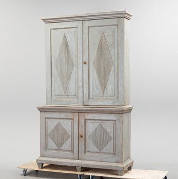 A late gustavian cabinet, circa 1800.