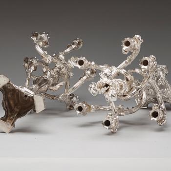A pair of Swedish 19th century silver candelabras, marks of Gustaf Möllenborg, Stockholm 1845 and 1893.