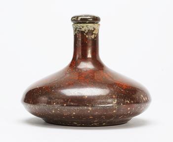 A Hans Hedberg faience bottle with stopper.