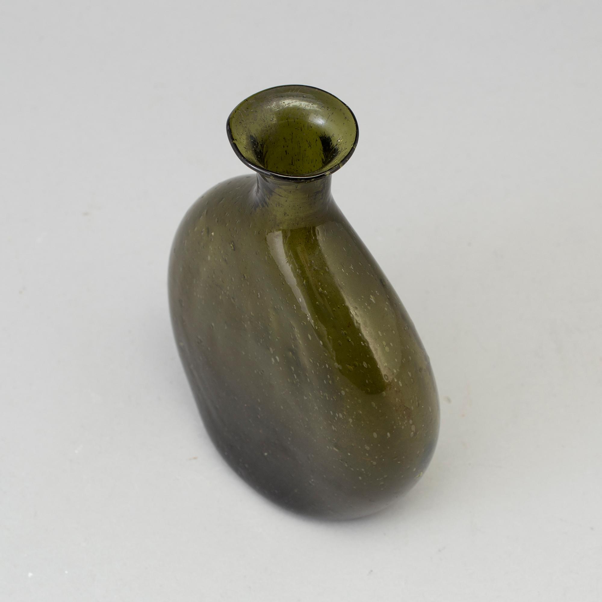 A 18th century glass bottle.