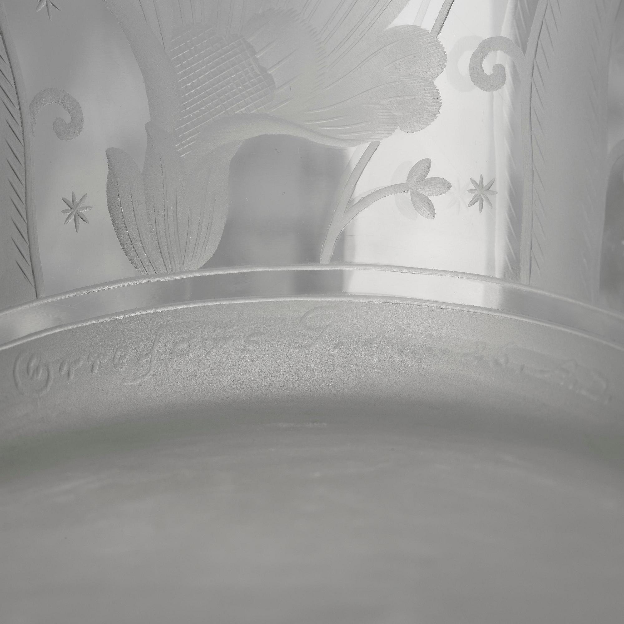 Simon Gate, an engraved Swedish Grace glass bowl on a plate, Orrefors, Sweden 1926, model 147.