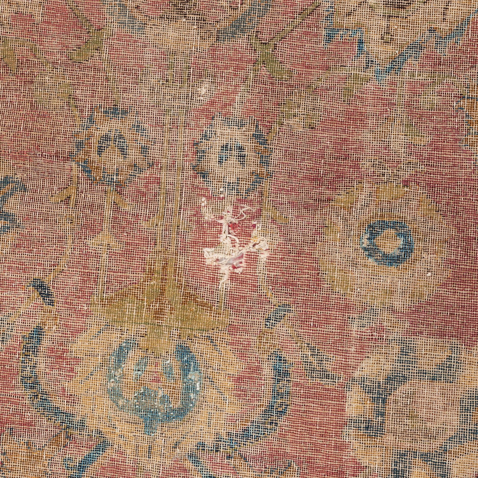 A safavid 'Spiral vine' Esfahan carpet, central persia, mid to second haft of the 17th century. Ca 562 x 231 cm.