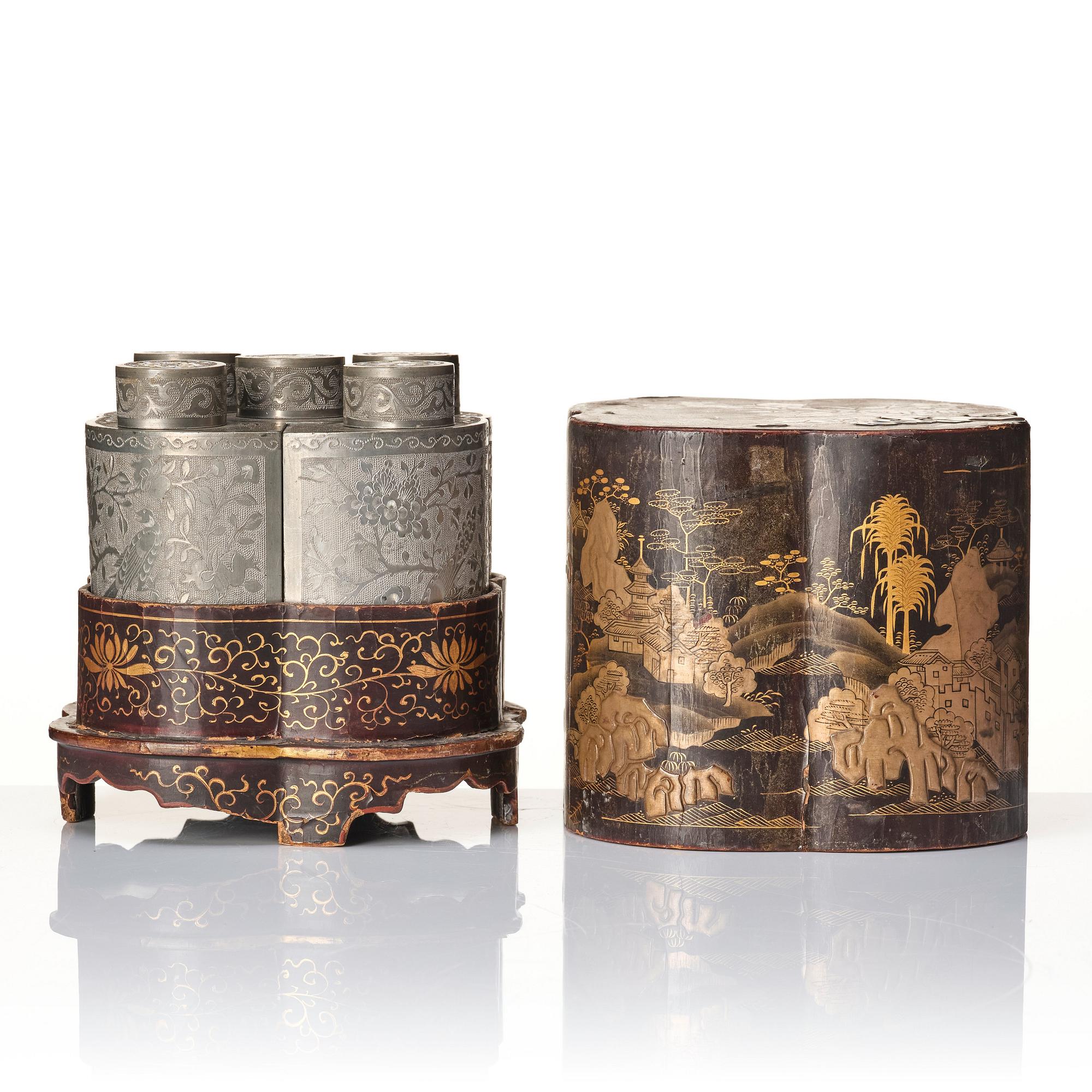 A Chinese lacquer box with a set of five pewter tea caddies, Qing dynasty, 18/19th Century.