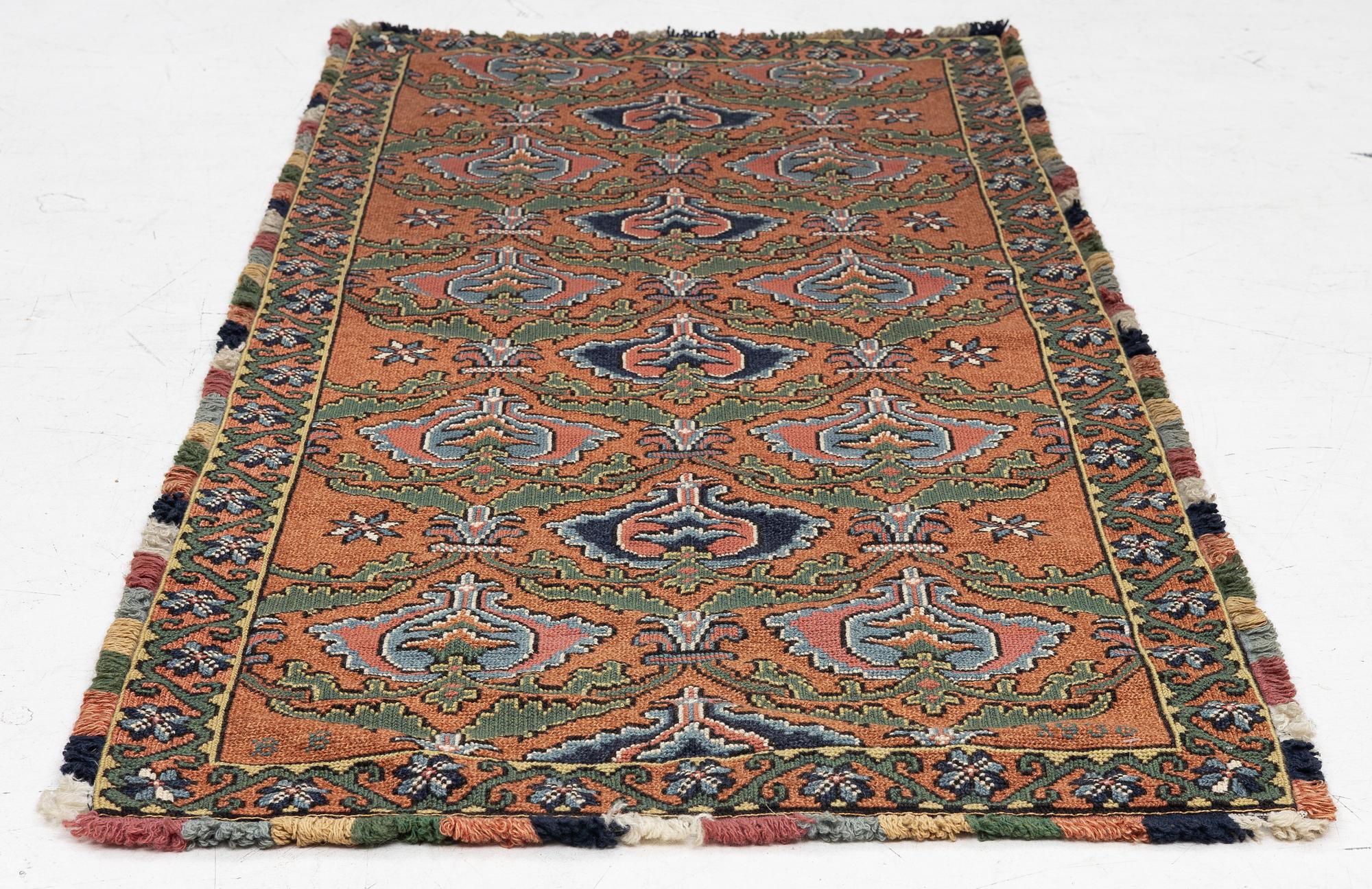 A sleigh cushion, signed BB and dated 1936, c. 160 x 67 cm.