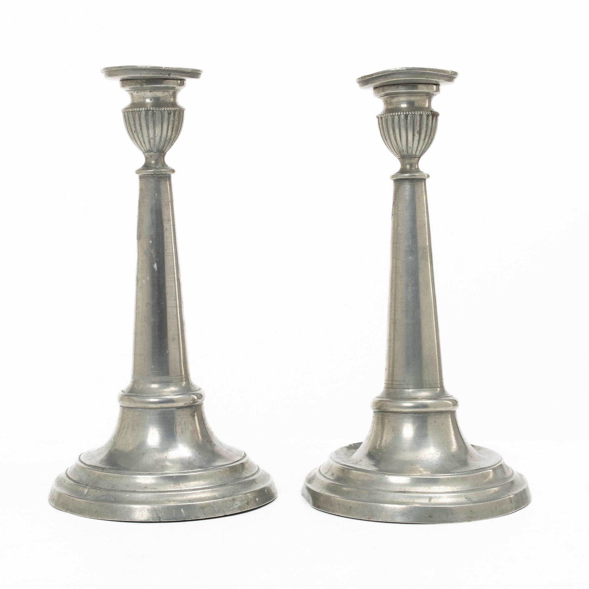 A pair of pewter candle sticks, Sweden, possibly 1844.