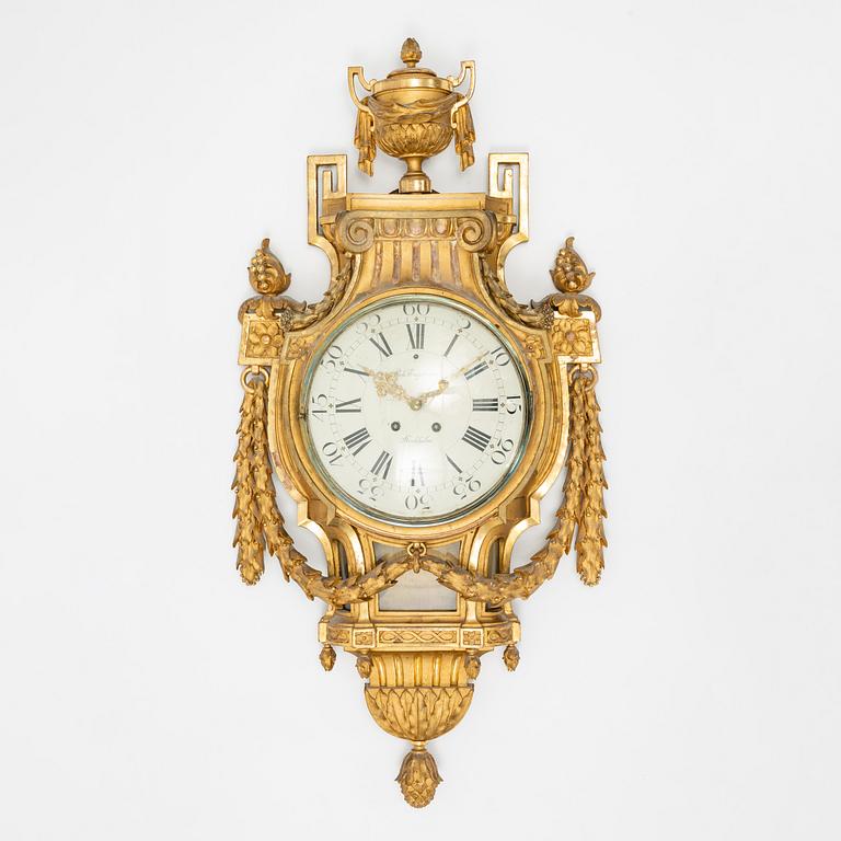 A Gustavian style gilt wood wall clock by Robert Engström, Stockholm, first half of the 20th Century.