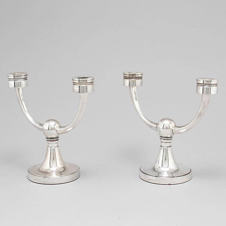 A pair of silver candelabra from MGAB, Uppsala, 1969-71.
