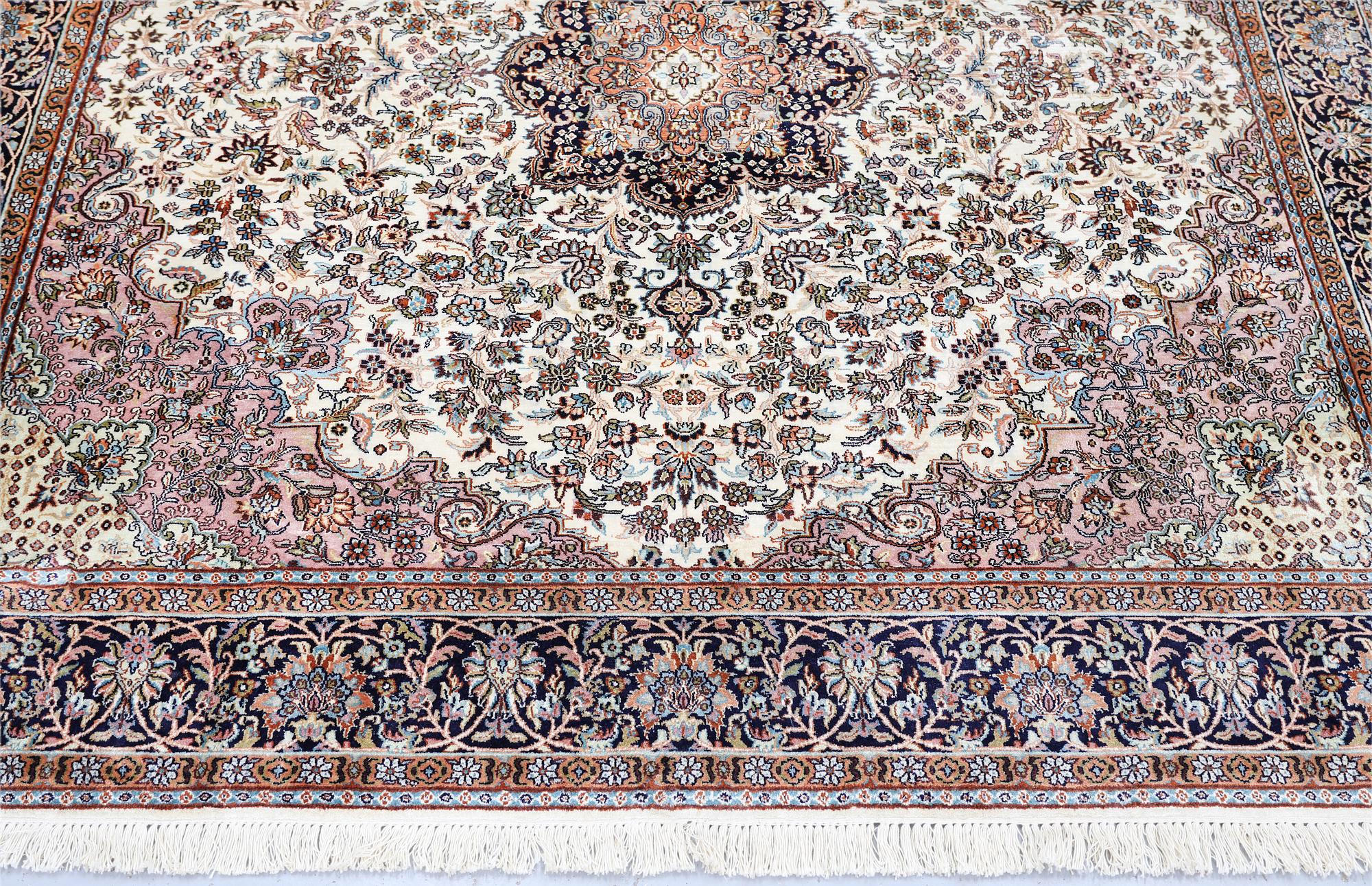 A Kashmir silk rug, approx. 215 x 212 cm.