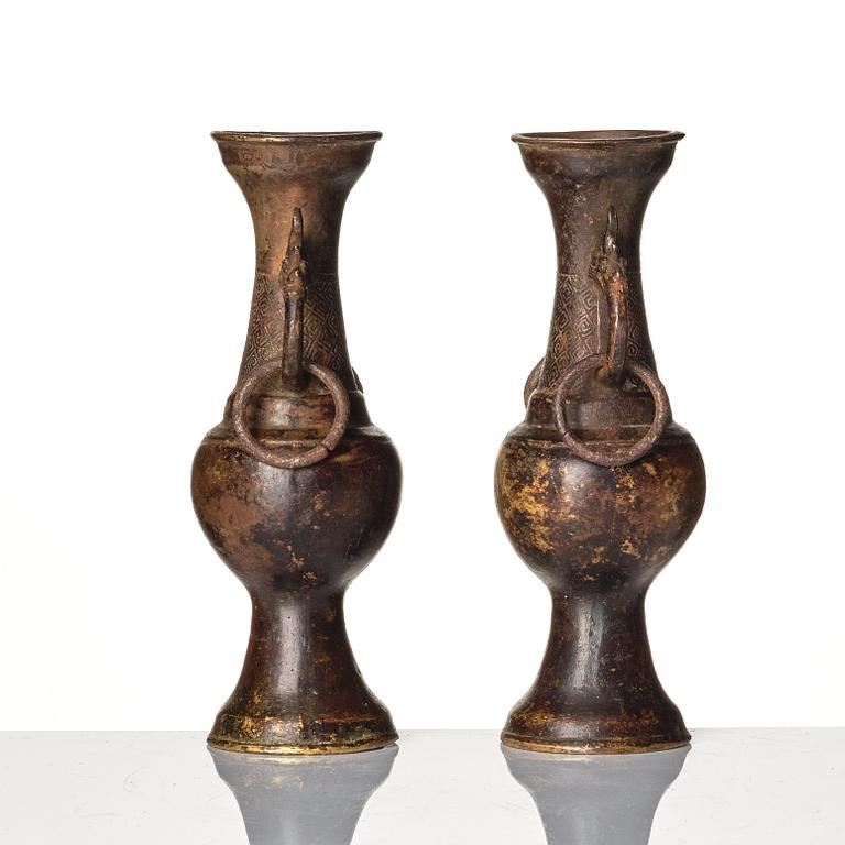 A pair of bronze altar vases, Ming dynasty (1368-1644).