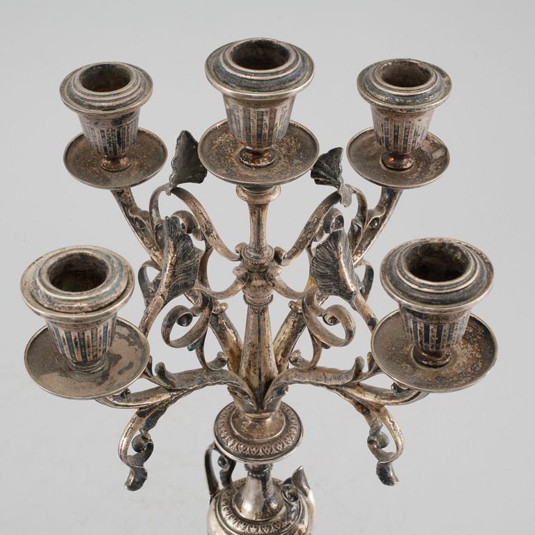 A pair of silver candelabras by Gustaf Möllenborg 1823-1850 (1930), Stockholm, 1875.