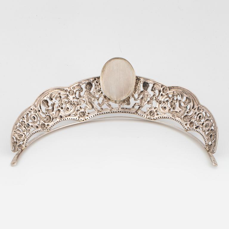 A silver and miniatyre portrait on porcelain tiara.