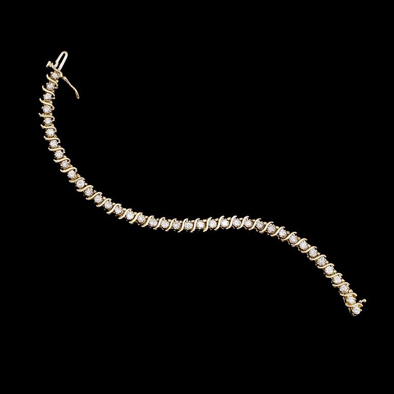 ARMBAND, 14 k guld, briljantslipade diamanter tot ca 5.40 ct.
