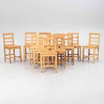 A gateleg table eith 6 + 6 chairs.