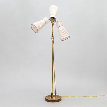 A three-arm floor lamp in brass, mid 20th century.