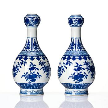 A pair of Chinese blue and white vases, late Qing dynasty/Republic with Qianlong seal mark.