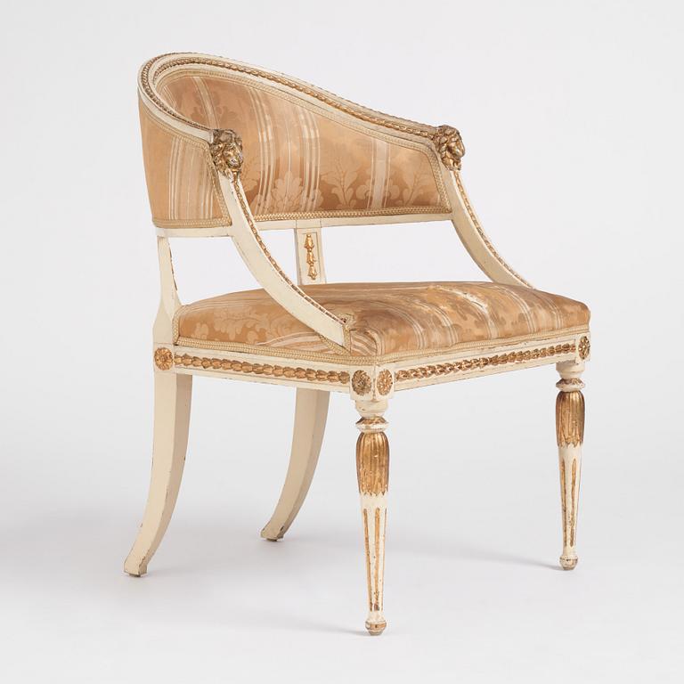 A late Gustavian carved and part-gilt open armchair, late 18th century.