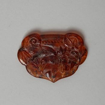 A carved Ruyi-shaped piece of Amber, early 20th Century.