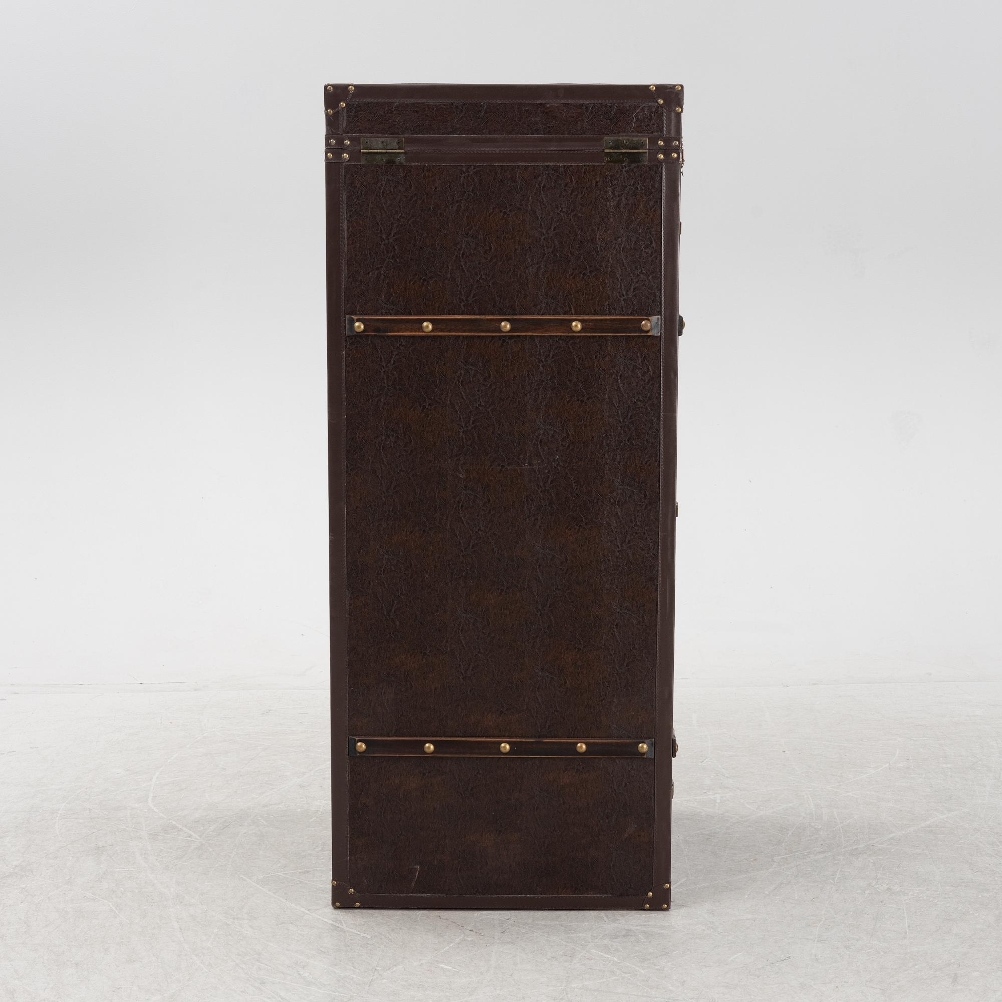 A leather suitcase-shaped bar cabinet.