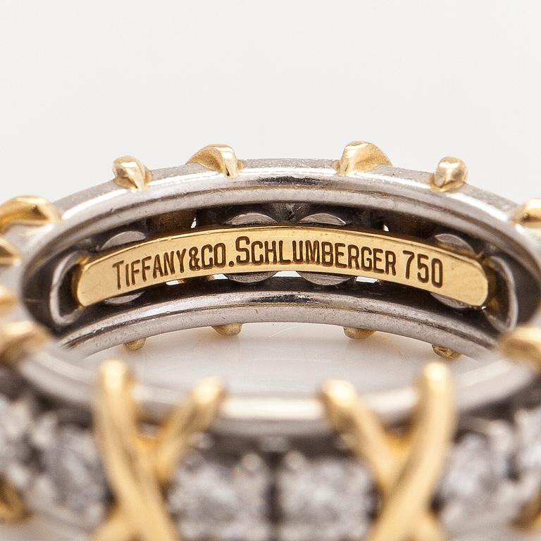 Tiffany & Co, a platinum and 18K gold 'Schlumberger' ring, with brilliant-cut diamonds.