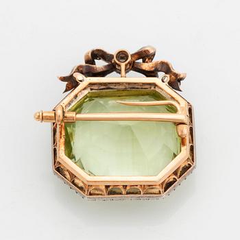 A heliodor brooch set with old- and rose-cut diamonds.