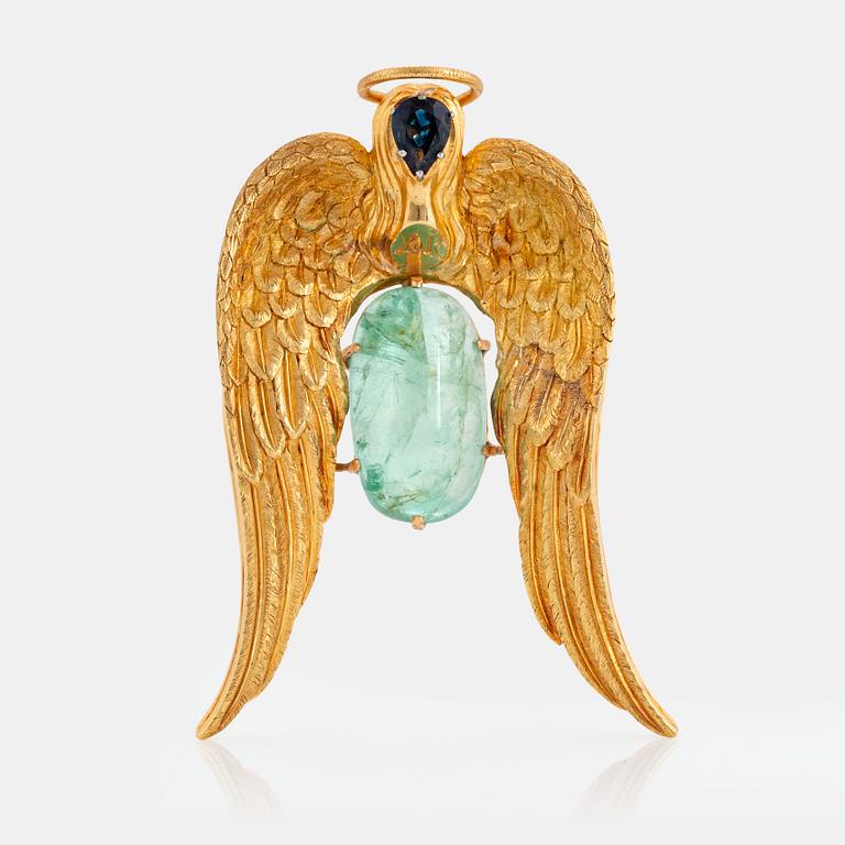 A 14K gold pendant by Salvador Dalí set with a cabochon-cut emerald and a faceted sapphire.