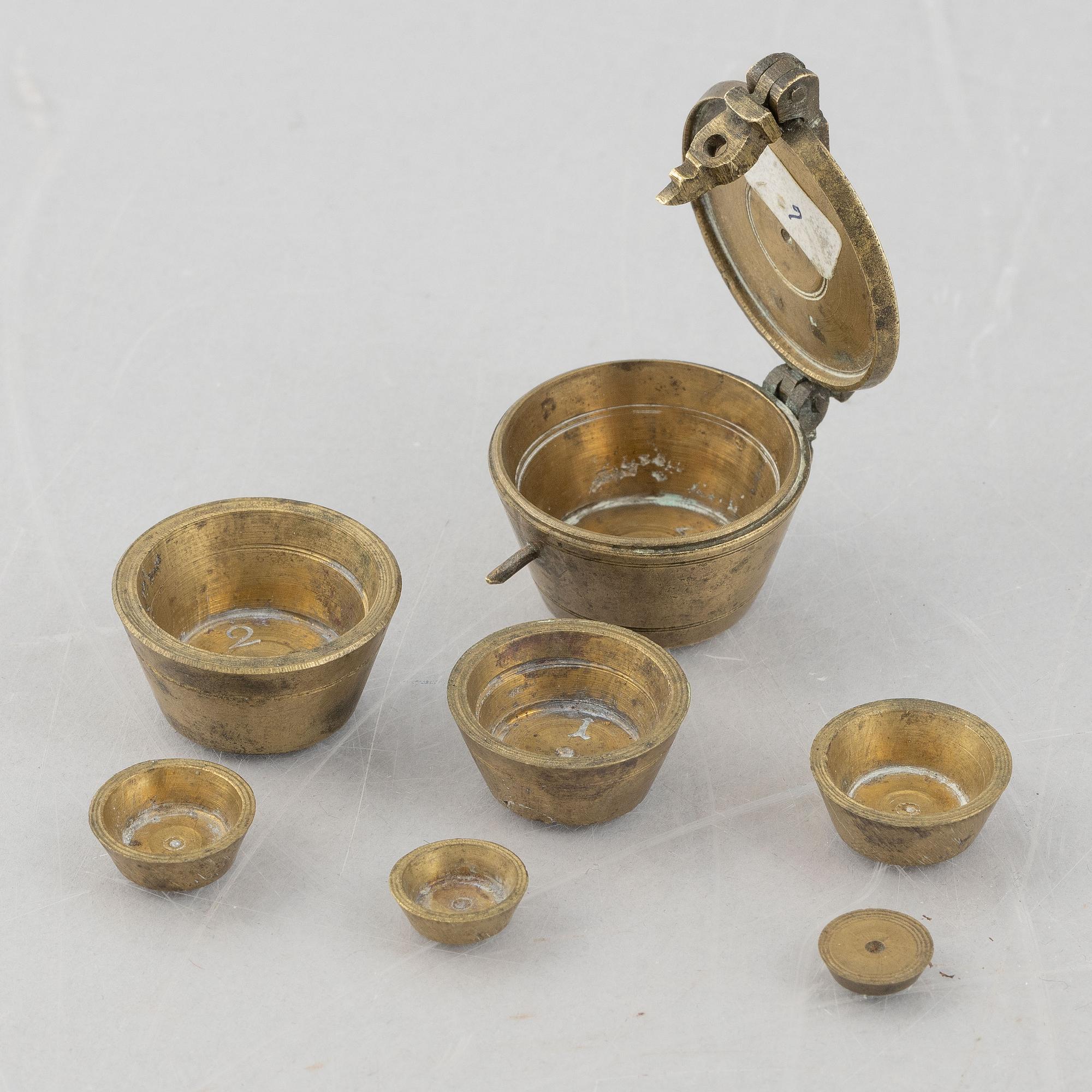 A set of three Nuremberg brass nested cup weights, one by Christoph or Johan Conrad Schön (masters 1746(1750).