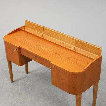 A 1940's table with pouf.