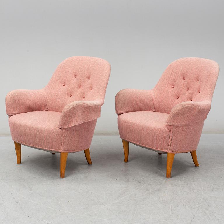 A pair of second half of the 20th Century 'Cirkus' easy chairs by Carl Malmsten.
