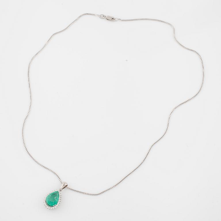 An emerald and brilliant cut diamond pendant.