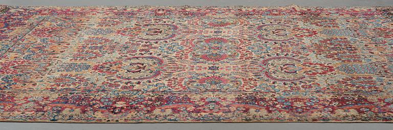 A carpet, a semi-antique Kerman, ca 375-379,5 x 268-271 cm.