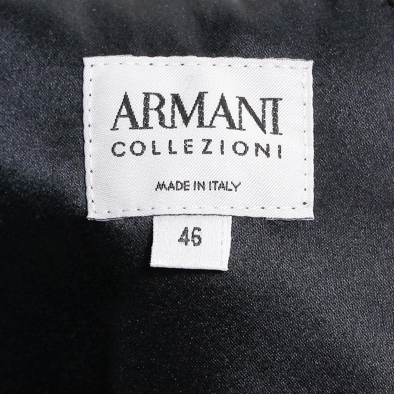 ARMANI, a black long silk dress.