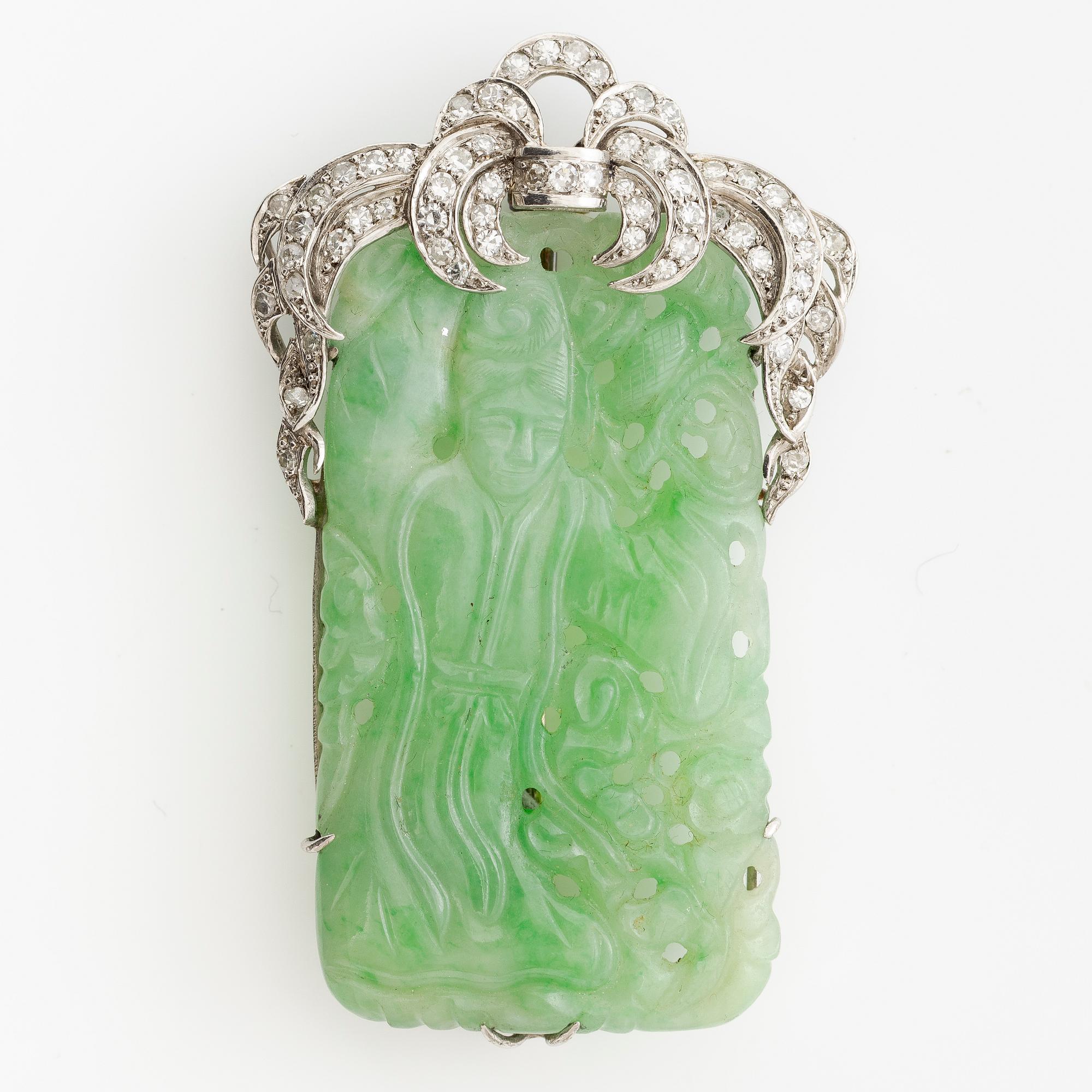 Brooch, platinum with carved jade and octagon-cut diamonds.