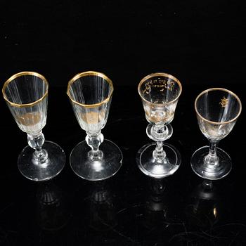 A set of four odd glasses, early 19th Century.