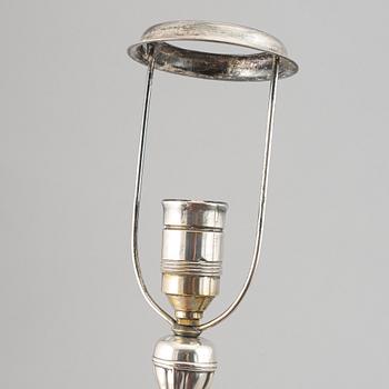 A silver plate neo-rococo tablelamp by CG Hallberg.