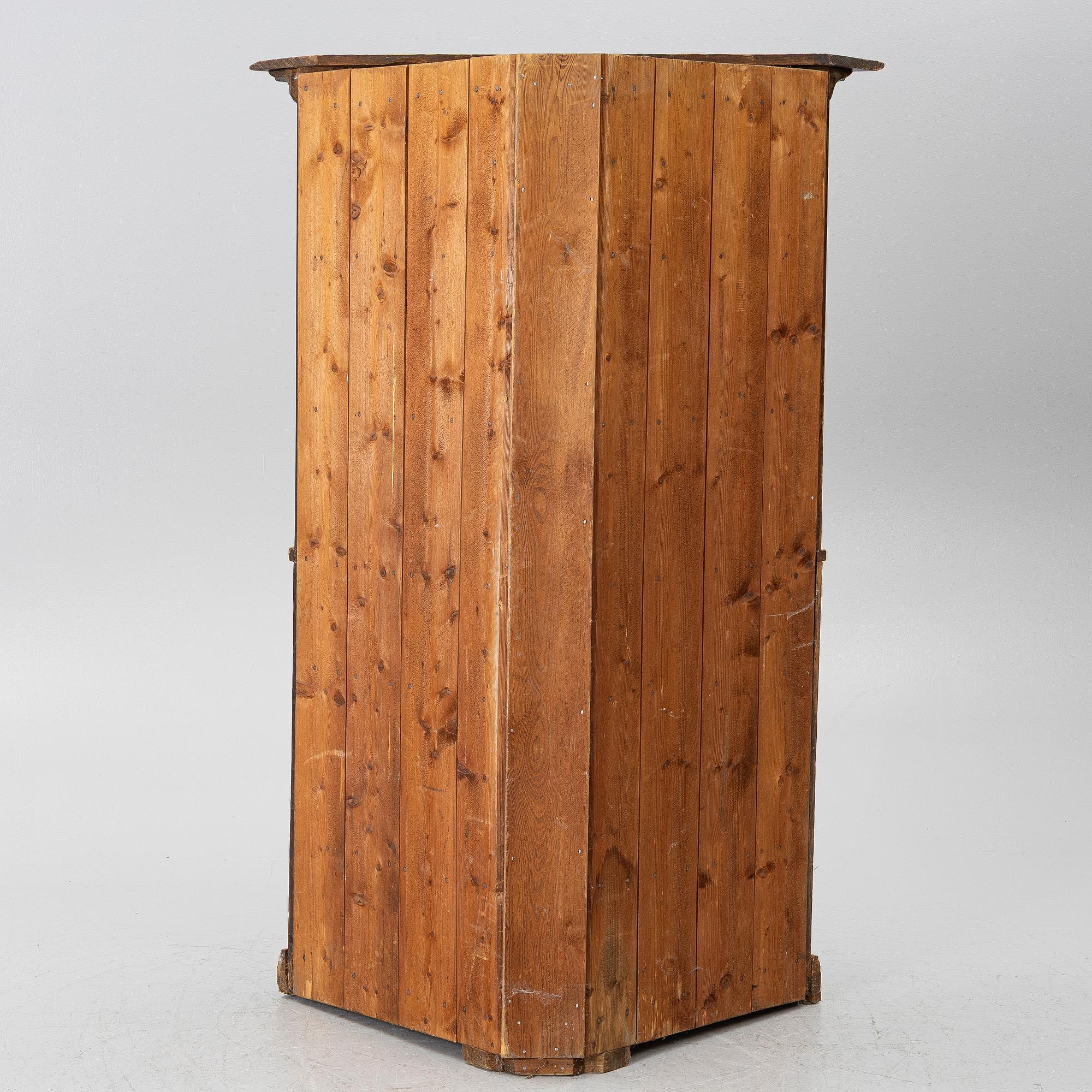 A corner cupboard, dated 1779.