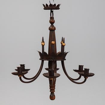 An iron and oak chandelier, 20th Century.